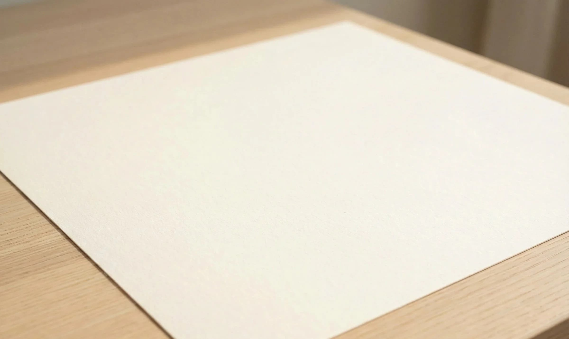 A raw cotton fabric swatch on a wooden table